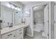 Well-lit bathroom with double vanity and tub/shower combo at 1507 Blaze Ln, Charleston, SC 29412