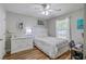 Cozy bedroom with hardwood floors, a ceiling fan, and stylish decor at 1507 Blaze Ln, Charleston, SC 29412