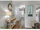 Hallway featuring hardwood floors and stylish decor, leading to other parts of the home at 1507 Blaze Ln, Charleston, SC 29412