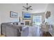Comfortable living room with a ceiling fan, a fireplace, and sliding glass doors to the outdoor area at 1507 Blaze Ln, Charleston, SC 29412