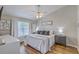Comfortable bedroom with a ceiling fan, natural light, and a soft, inviting bed at 1507 Blaze Ln, Charleston, SC 29412