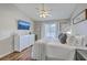 Well-lit main bedroom with a ceiling fan, a TV, and a serene atmosphere at 1507 Blaze Ln, Charleston, SC 29412