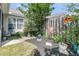 Landscaped backyard with a wooden fence and patio area, perfect for outdoor entertaining and relaxation at 157 Townsend Way, Summerville, SC 29483