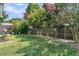Fenced backyard with lush green grass and landscaping, offering a private and serene outdoor space at 157 Townsend Way, Summerville, SC 29483