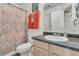 Well-maintained bathroom featuring a vanity with countertop sink and a shower with colorful shower curtain at 157 Townsend Way, Summerville, SC 29483