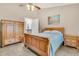 Relaxing bedroom featuring a ceiling fan, a nightstand, and a beach-themed painting at 157 Townsend Way, Summerville, SC 29483