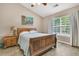 Charming bedroom with a ceiling fan, a window that provides plenty of natural light, and a beach-themed painting at 157 Townsend Way, Summerville, SC 29483