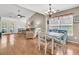Bright dining area open to the living room, featuring hardwood floors and natural light at 157 Townsend Way, Summerville, SC 29483