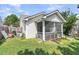 Back exterior view showing a screened porch, landscaped yard and AC unit, showcasing outdoor features at 157 Townsend Way, Summerville, SC 29483