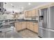 Spacious kitchen with stainless steel appliances, ample counter space, and natural wood cabinets at 157 Townsend Way, Summerville, SC 29483