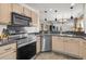 Bright kitchen featuring stainless appliances, granite countertops and a breakfast bar that opens to the living area at 157 Townsend Way, Summerville, SC 29483