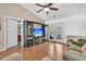 Bright living room with hardwood floors and access to outdoor patio through French doors at 157 Townsend Way, Summerville, SC 29483