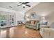Comfortable living area with hardwood floors and view of the backyard through French doors at 157 Townsend Way, Summerville, SC 29483
