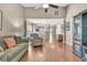 Open-concept living area featuring hardwood floors and seamless flow into kitchen at 157 Townsend Way, Summerville, SC 29483