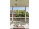 Balcony with white columns and railing overlooking a tree and the neighborhood at 17 Wentworth St, Charleston, SC 29401