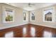 Bright bedroom featuring hardwood floors, and multiple windows allowing natural light and views at 17 Wentworth St, Charleston, SC 29401