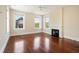 Bright bedroom featuring hardwood floors, fireplace, and multiple windows allowing natural light at 17 Wentworth St, Charleston, SC 29401