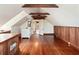 Bright bonus room featuring high ceilings, hardwood floors, wood paneled walls and a storage cabinet at 17 Wentworth St, Charleston, SC 29401