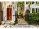 An exterior view of two brick homes with beautiful contrasting entrances at 17 Wentworth St, Charleston, SC 29401