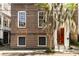 Traditional brick building facade with symmetric windows and a striking door at 17 Wentworth St, Charleston, SC 29401