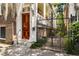 Elegant entrance featuring a polished wood door, marble steps, and wrought iron gate at 17 Wentworth St, Charleston, SC 29401