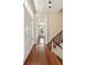 Hallway with hardwood floors leading to a staircase and a room with a window at 17 Wentworth St, Charleston, SC 29401
