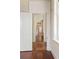 Hallway featuring hardwood floors and white trim, leading to other rooms in the house at 17 Wentworth St, Charleston, SC 29401