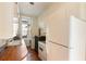 Cozy kitchen featuring butcher block countertops, white cabinets, and vintage appliances at 17 Wentworth St, Charleston, SC 29401