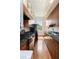Galley kitchen with granite countertops, wood cabinets, and stainless steel sink at 17 Wentworth St, Charleston, SC 29401