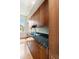 Modern kitchen with granite countertops, wood cabinets, and stainless steel sink with a large window at 17 Wentworth St, Charleston, SC 29401