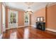 Elegant living room featuring a decorative fireplace, chandelier, and hardwood floors at 17 Wentworth St, Charleston, SC 29401