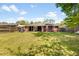 Sprawling backyard with a patio, seating, and a well-manicured lawn at 1821 Wasp St, North Charleston, SC 29405