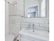 Modern bathroom featuring a white subway tile shower, floating vanity, and LED mirror at 1821 Wasp St, North Charleston, SC 29405