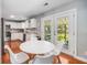 Cozy dining area with patio view and white modern furnishings at 1821 Wasp St, North Charleston, SC 29405