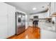 Modern kitchen with stainless steel appliances, granite countertops, and white cabinetry at 1821 Wasp St, North Charleston, SC 29405