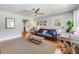 Bright living room featuring hardwood floors, a ceiling fan, and a cozy seating area at 1821 Wasp St, North Charleston, SC 29405