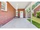Brick patio leads to the laundry room, offering practical outdoor space at 1821 Wasp St, North Charleston, SC 29405