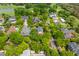 Aerial view of a luxury neighborhood with mature trees, manicured lawns, and custom homes at 2 Pagett St, Daniel Island, SC 29492
