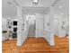 Open floor plan with wood floors, staircase, and detailed trim work at 2 Pagett St, Daniel Island, SC 29492