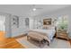 Bright main bedroom with built-in cabinets, hardwood floors, and beautiful natural light at 2 Pagett St, Daniel Island, SC 29492