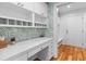 Charming office space with leafy wallpaper, built-in storage, and a white countertop at 2 Pagett St, Daniel Island, SC 29492