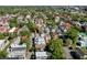 A captivating aerial view of a densely packed residential neighborhood with colorful rooftops and lush trees at 20 Felix St, Charleston, SC 29403