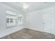 Bright bedroom features neutral walls, carpeted floors, and natural light from two windows, plus a ceiling fan at 2009 E Patterson Pt, Hanahan, SC 29410