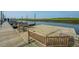 Tranquil waterfront dock featuring benches for relaxation along the serene river within the community at 2009 E Patterson Pt, Hanahan, SC 29410