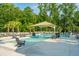 Relaxing pool with lounge chairs and umbrellas providing a serene community gathering spot at 2009 E Patterson Pt, Hanahan, SC 29410