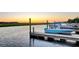 Sunset view of the community dock with boats providing access to recreational waters at 2009 E Patterson Pt, Hanahan, SC 29410
