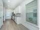 Beautiful kitchen features white cabinets, stainless steel appliances, granite counters, and a window at 2009 E Patterson Pt, Hanahan, SC 29410