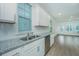 Modern kitchen featuring white cabinets, stainless steel appliances, and granite countertops at 2009 E Patterson Pt, Hanahan, SC 29410