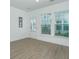 Bright living room with recessed lighting, vinyl floors, and access to a door and backyard at 2009 E Patterson Pt, Hanahan, SC 29410