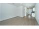 Spacious open-concept living room with vinyl flooring adjacent to the bright, modern kitchen at 2009 E Patterson Pt, Hanahan, SC 29410